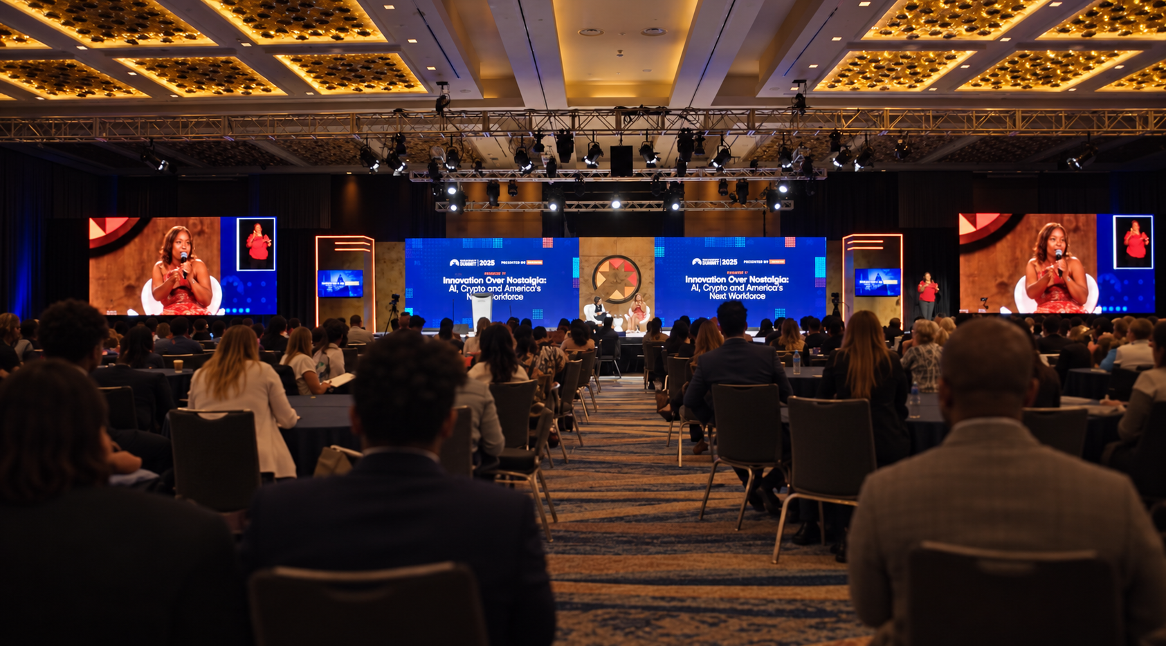 Wide audience view of the Prosperity Now Summit four-screen stage